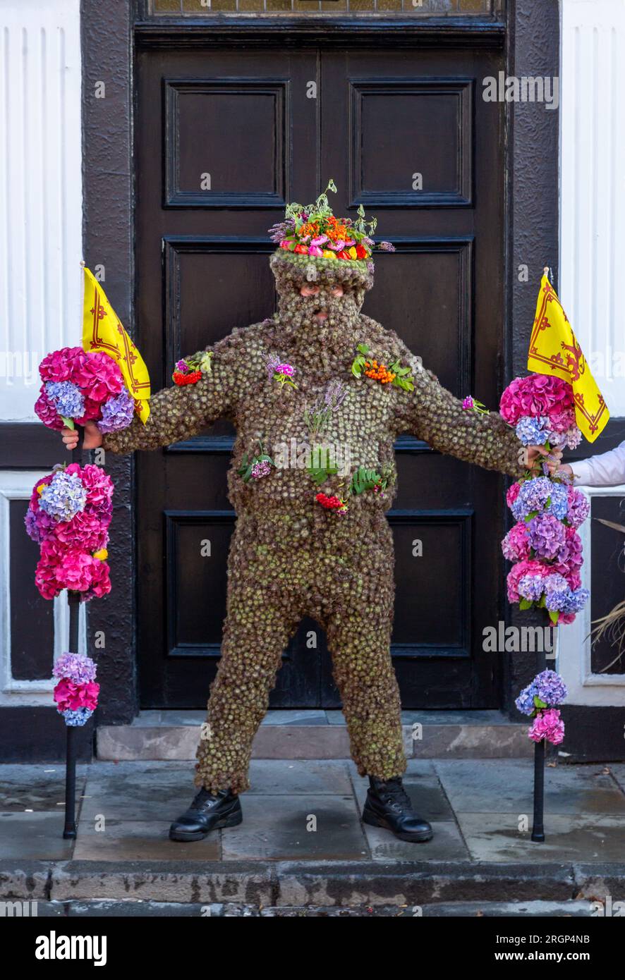 South Queensferry, Scotland. 11 August 2023. The Burryman or Burry Man is an ancient tradition a man covered in burrs is paraded through the town of South Queensferry, near Edinburgh for over nine hours. Tradition holds that he will bring good luck to the town if they give him whisky and money, and that bad luck will result if the custom is discontinued. © Richard Newton / Alamy Live News Stock Photo