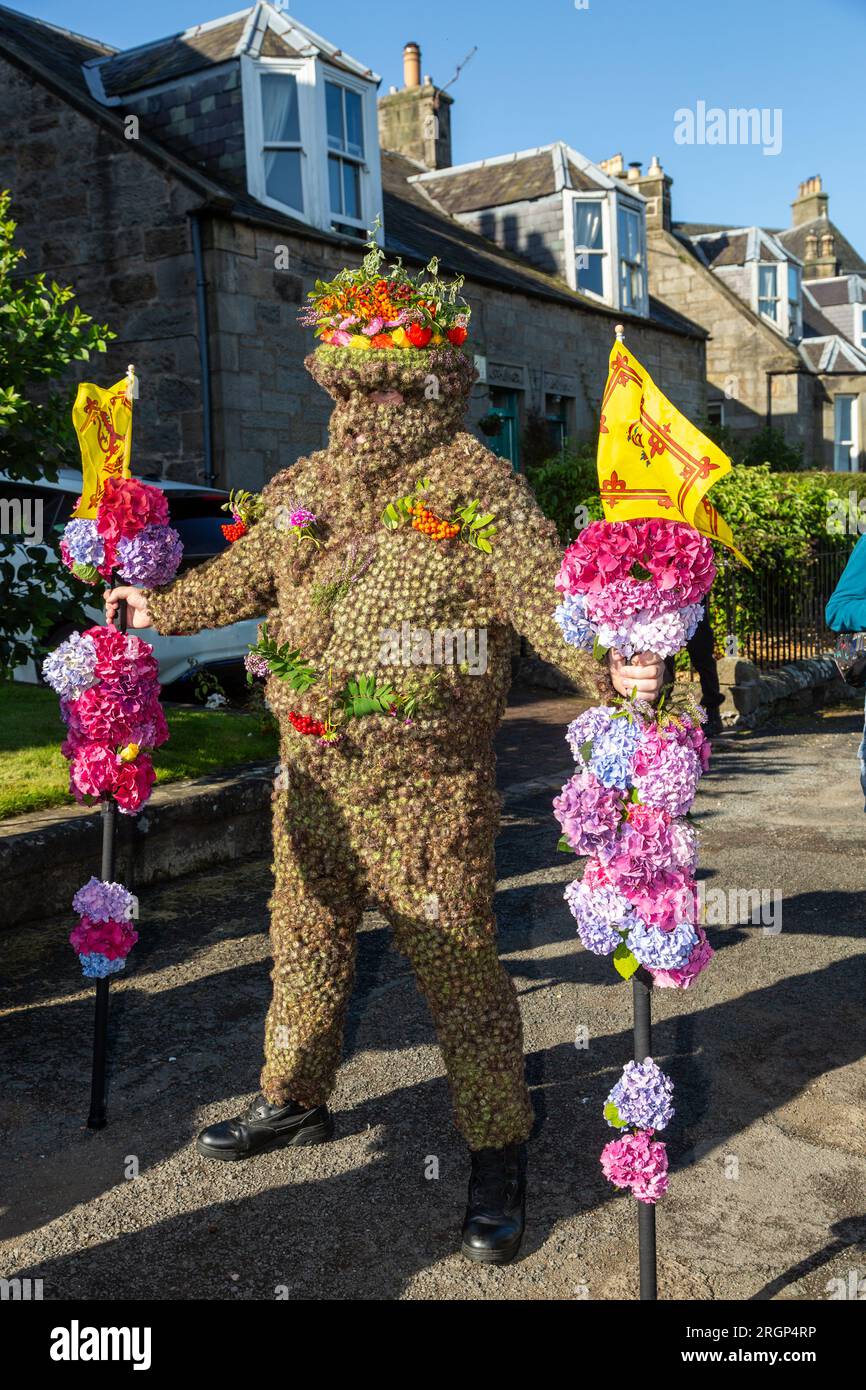 South Queensferry, Scotland. 11 August 2023. The Burryman or Burry Man is an ancient tradition a man covered in burrs is paraded through the town of South Queensferry, near Edinburgh for over nine hours. Tradition holds that he will bring good luck to the town if they give him whisky and money, and that bad luck will result if the custom is discontinued. © Richard Newton / Alamy Live News Stock Photo