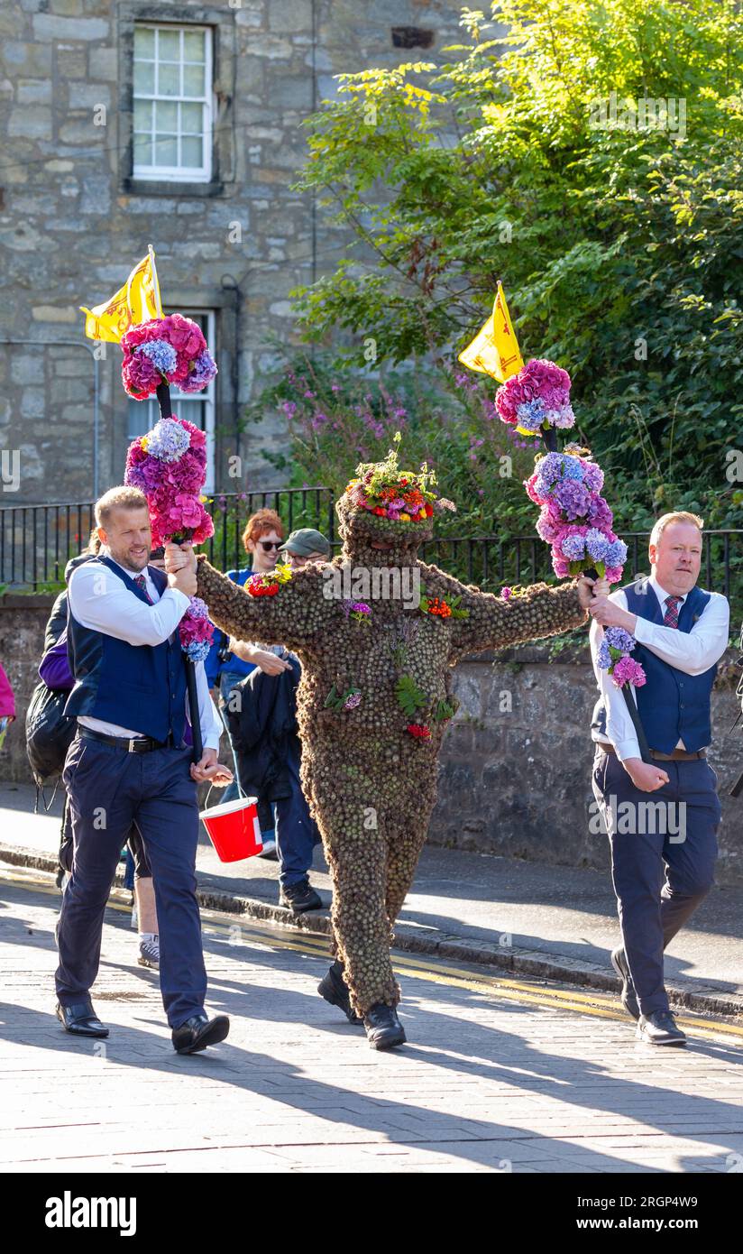 South Queensferry, Scotland. 11 August 2023. The Burryman or Burry Man is an ancient tradition a man covered in burrs is paraded through the town of South Queensferry, near Edinburgh for over nine hours. Tradition holds that he will bring good luck to the town if they give him whisky and money, and that bad luck will result if the custom is discontinued. © Richard Newton / Alamy Live News Stock Photo