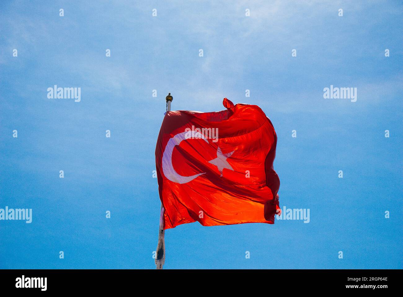 Turkish national flag with white star and moon in sky Stock Photo