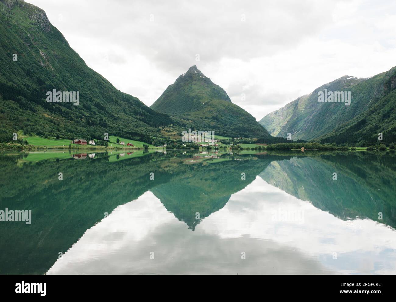 Norwegian fjord reflecting in the water in Norway Stock Photo