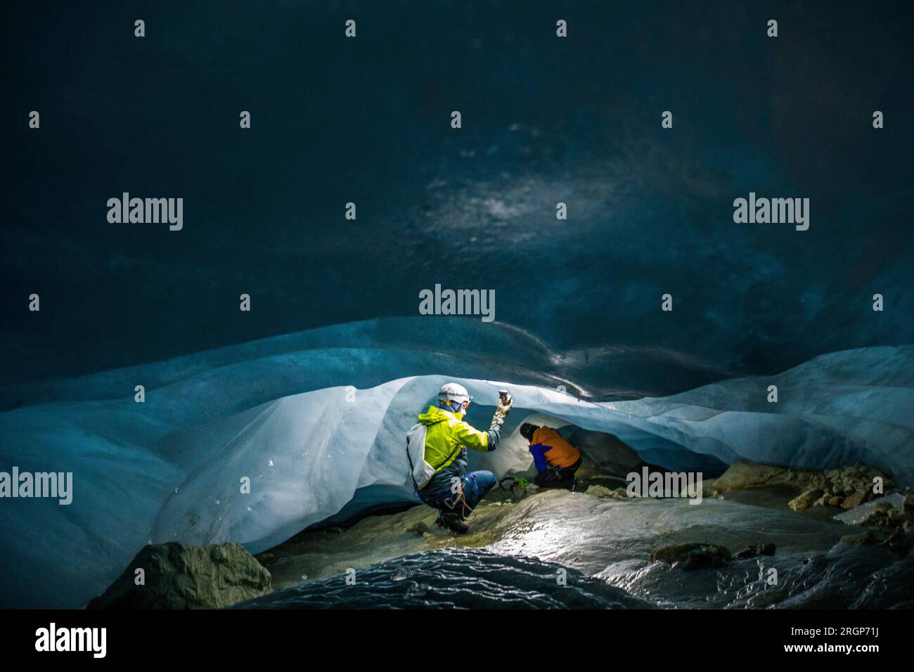 Climate researchers measure temperature in cave below glacier Stock