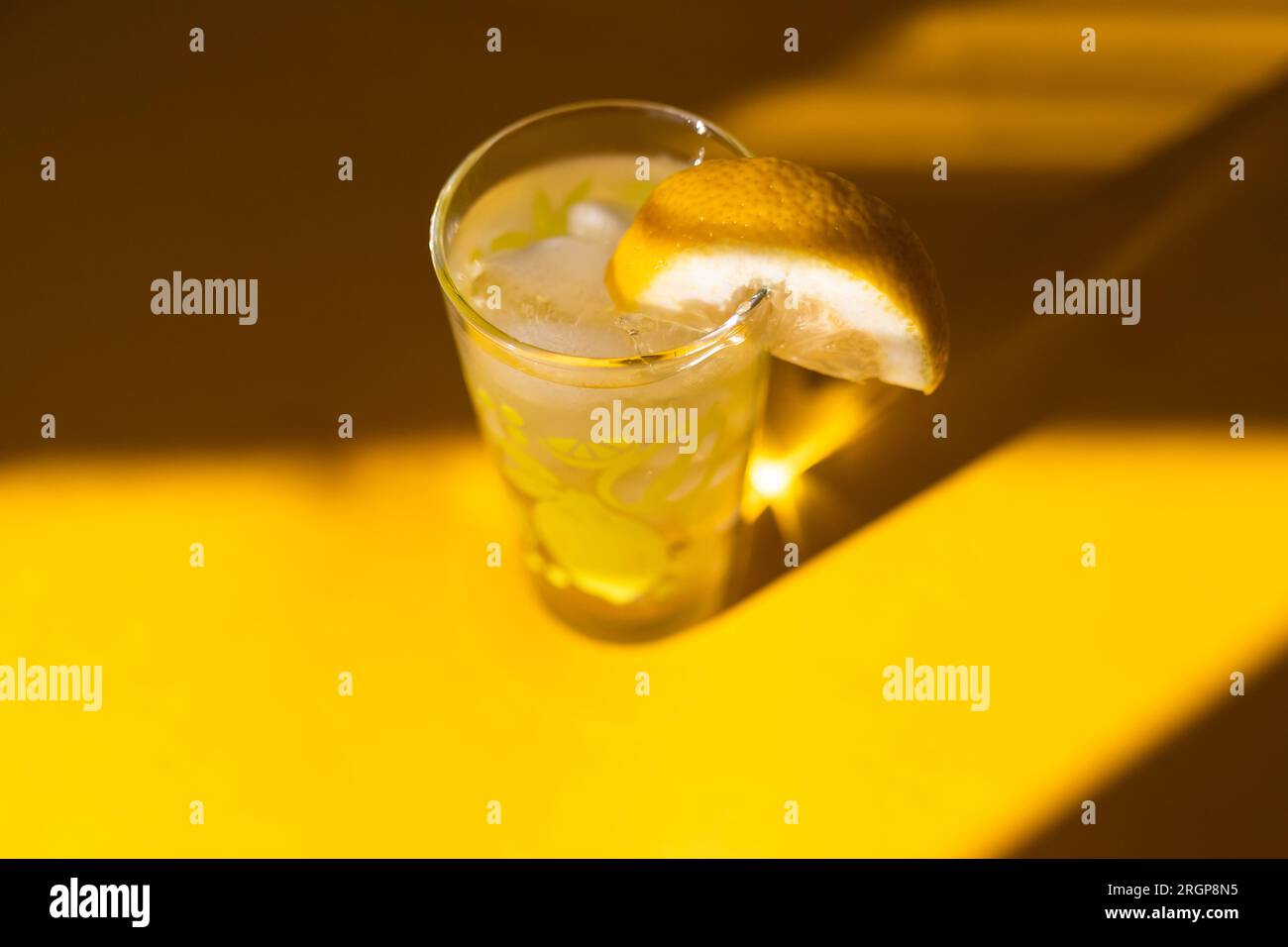 A glass of ice water with lemon Stock Photo