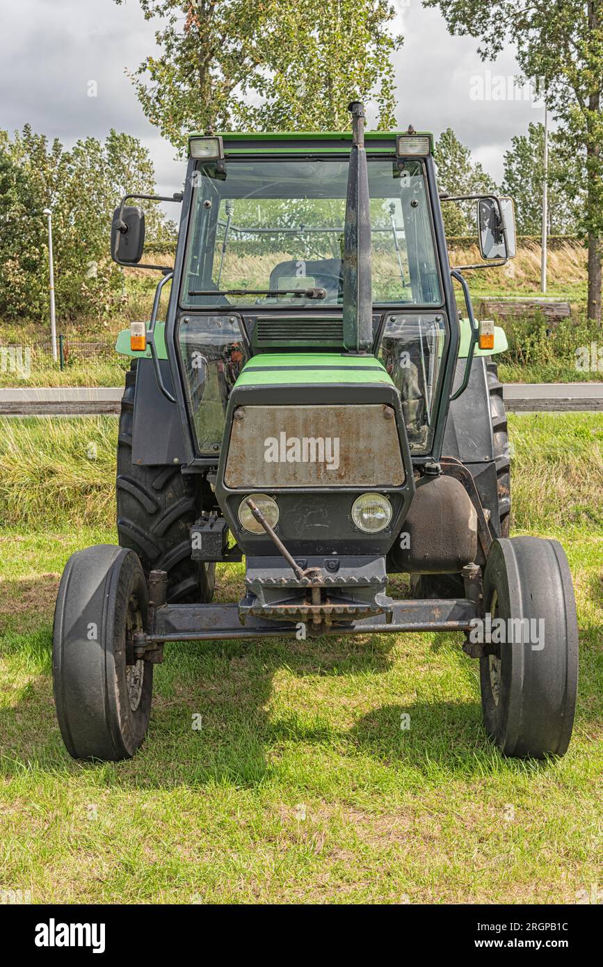 Deutz-fahr farm tractor is parked on a pasture Stock Photo