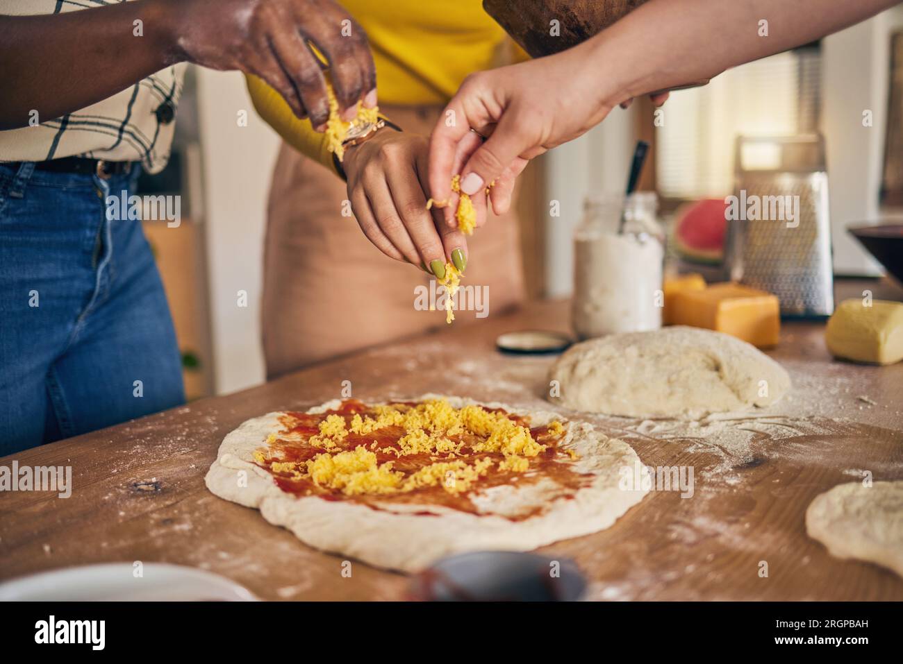 Hands, cheese and pizza for cooking, together and ready for fast food