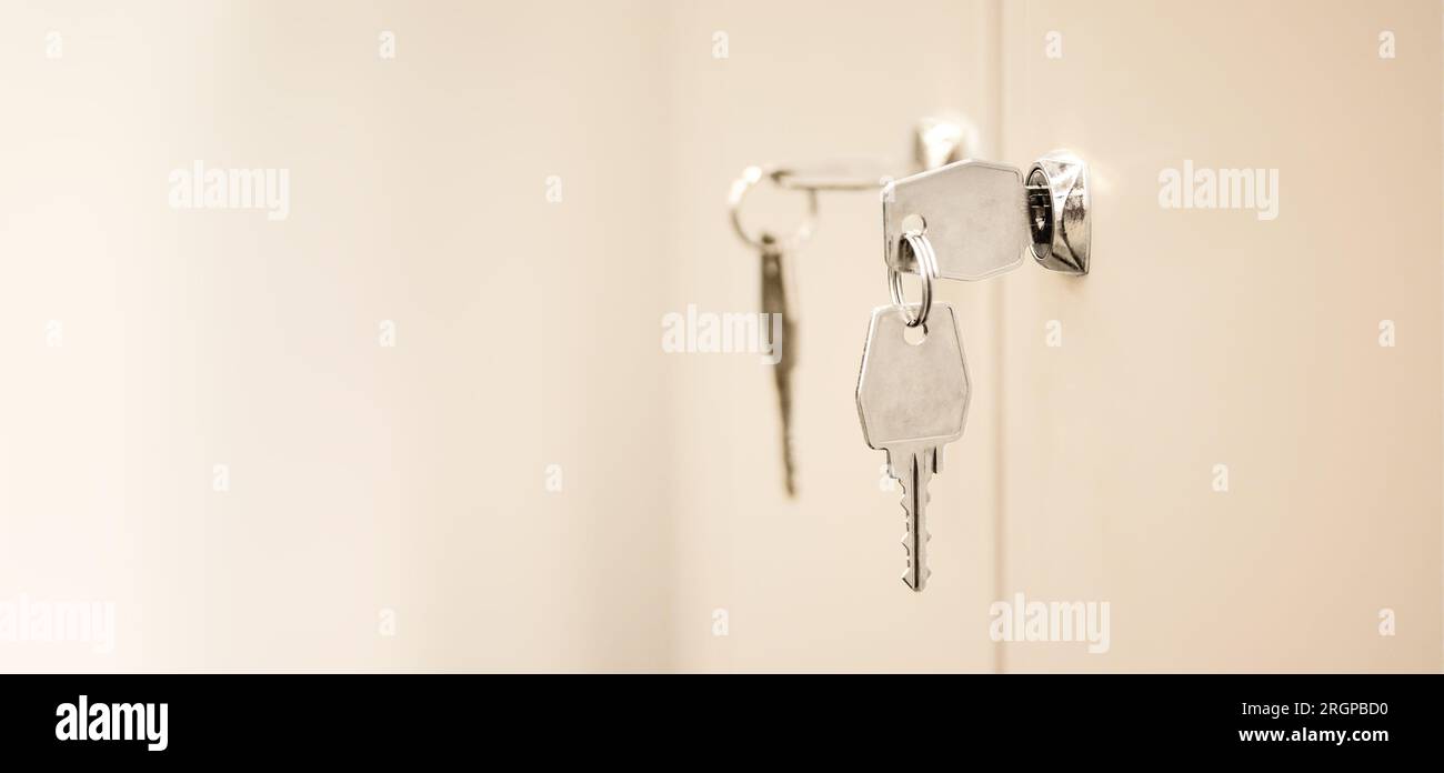 Lockers with keys in office. Secure lock system for safety document files in business office. Gym locker room Stock Photo