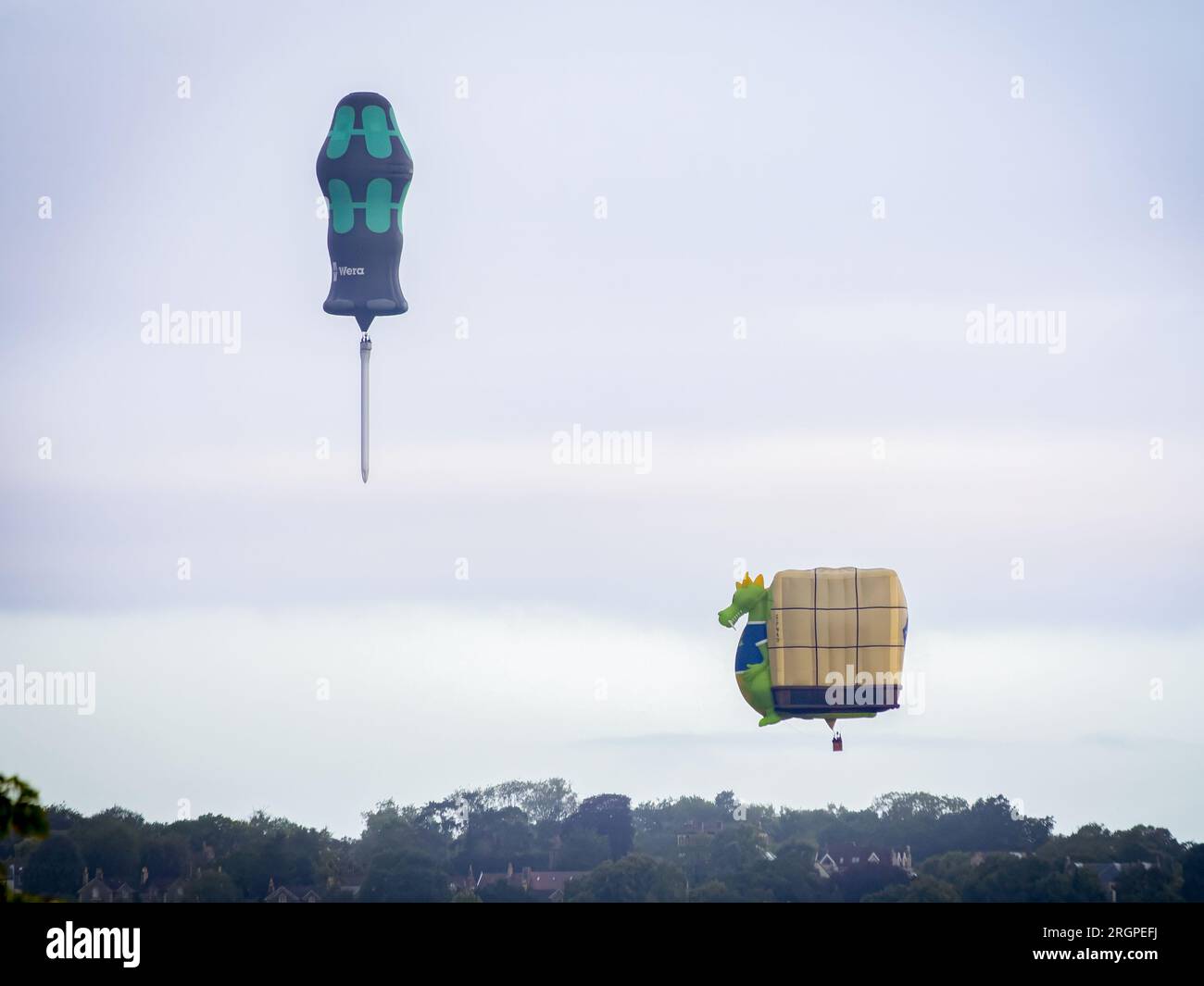 Screwdriver shaped hot air balloon flying over Clifton Suspension Bridge Stock Photo