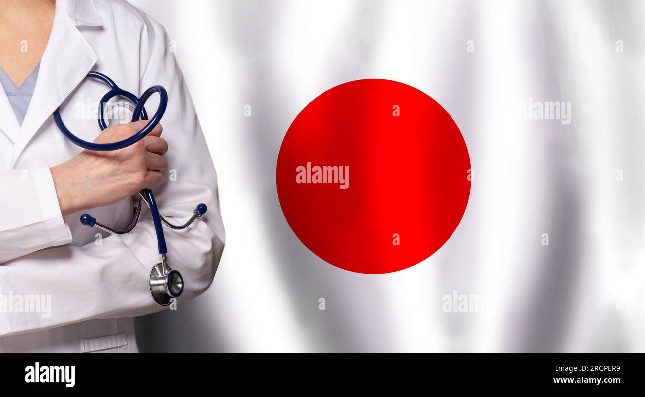 Japanese medicine and healthcare concept. Doctor close up against flag