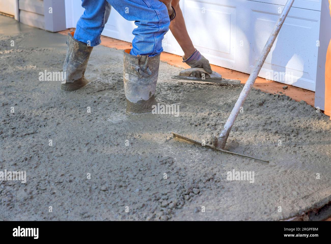 Red cement mix and trowel on the construction site Stock Photo - Alamy