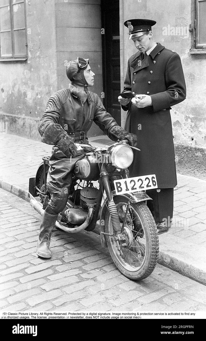 Motorcyclist in the 1950s. A young man dressed in the typical way the