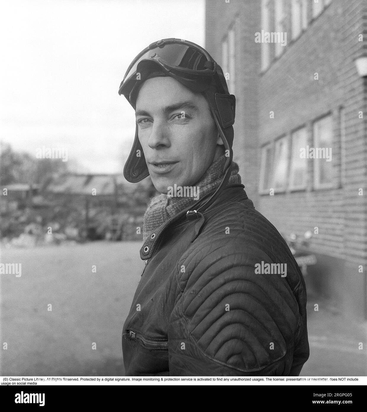 Motorcyclist in the 1950s. A young man dressed in the typical way the motorcyclists did in the 1950s. All leather. Leather boots, trousers and jacket. Instead of a helmet a leather cap was the typical headgear of the time.     Sweden 1953. He is actor Sven-Eric Gamble, 1924-1976. Kristoffersson ref BM72-2 Stock Photo