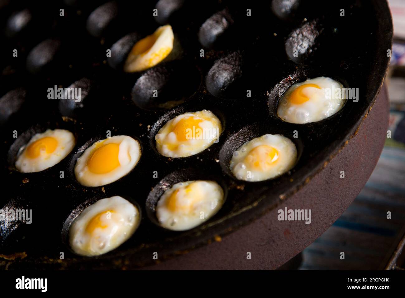 Fried quail eggs at a street food stall in Bangkok, Thailand Stock