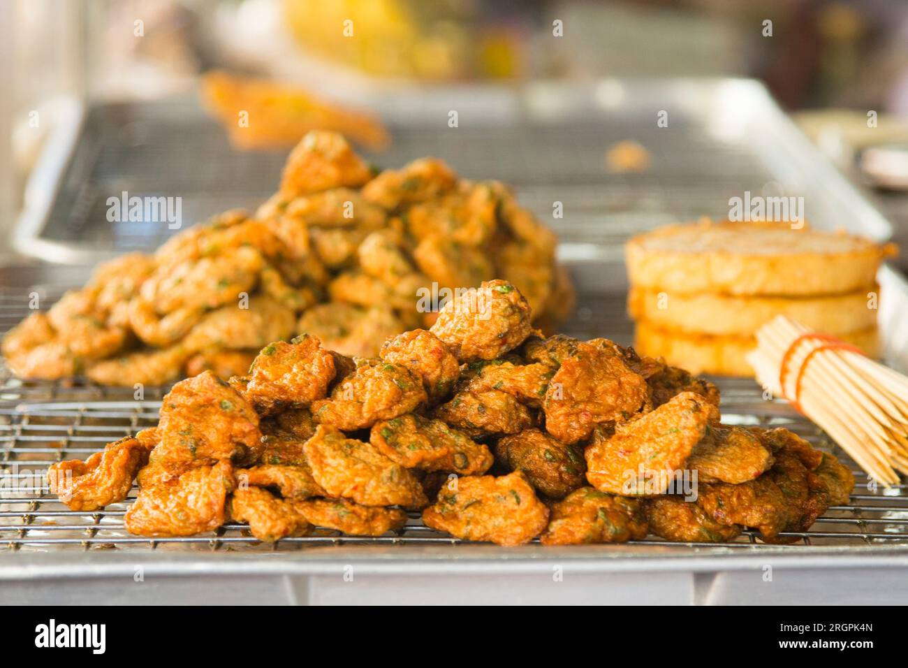 Fried fish starters at a street food stall in the city of Bangkok in