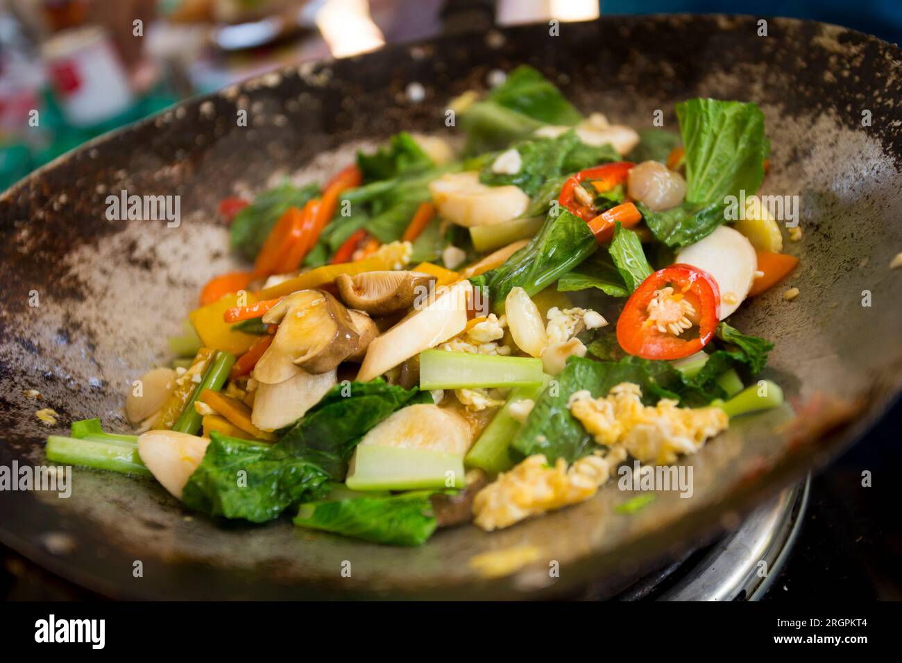 Vegetable wok at a street food stall on the streets of Bangkok ...