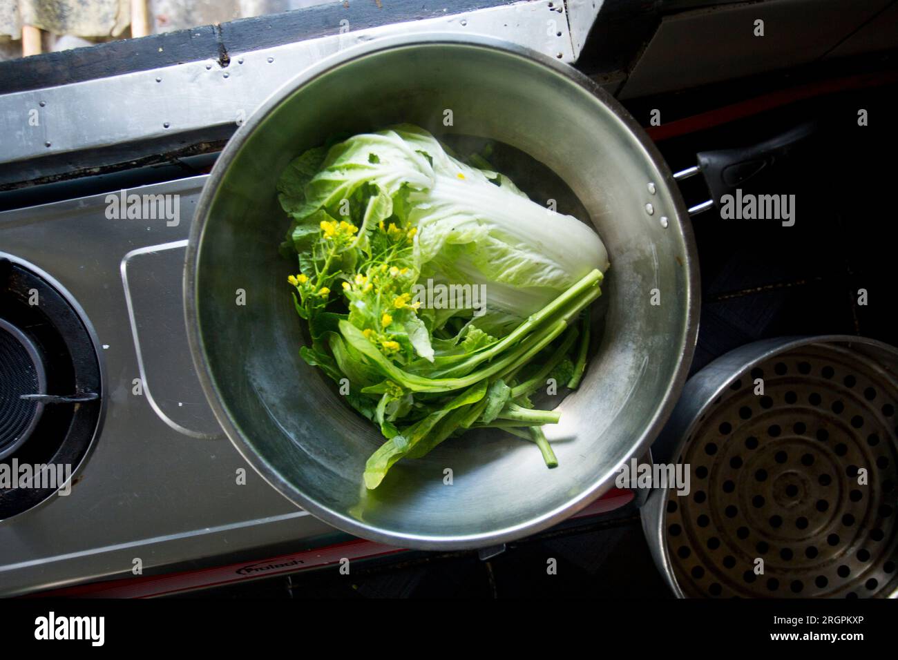 Frying pan cooking lettuce in a Bangkok kitchen in Thailand Stock Photo Alamy