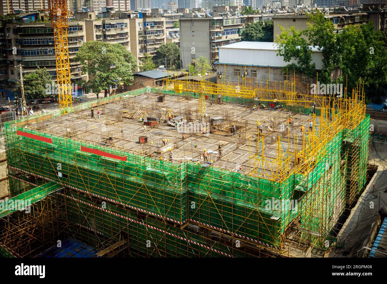 Building construction site, tall skyscrapers and cranes Stock Photo - Alamy