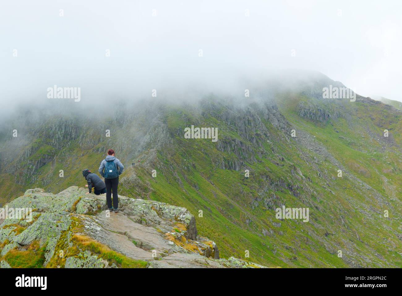 Walkers on Striding Edge, Helvellyn mountain, Cumbria Stock Photo - Alamy