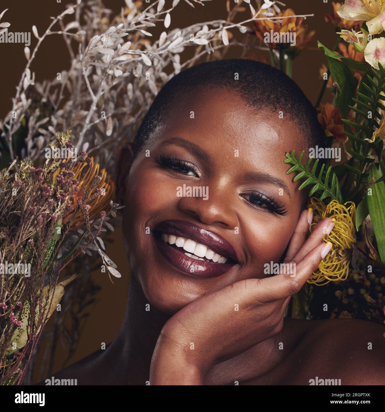African woman, plants and makeup in studio portrait with beauty