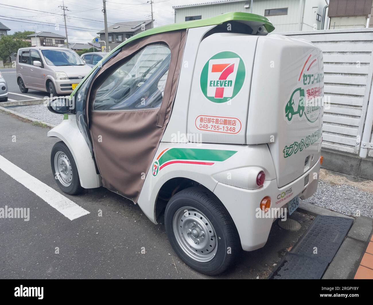 A Toyota 7Eleven convenience store electric delivery vehicle parked