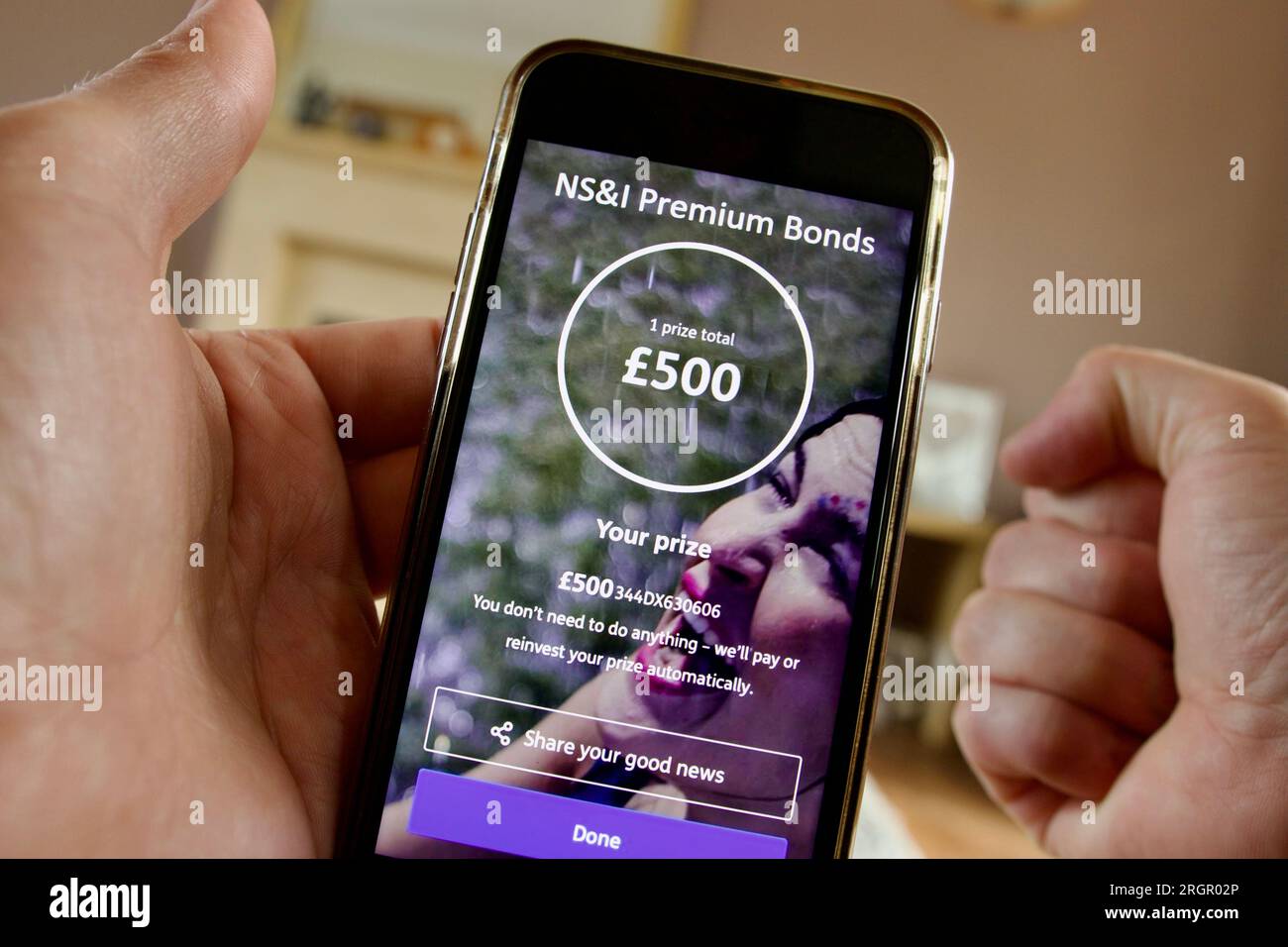 An NS&I Premium Bonds holder celebrates after revealing a £500 prize