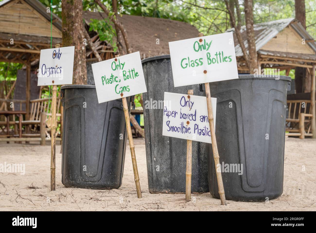 Waste separation on a beach in Thailand. Container for separate