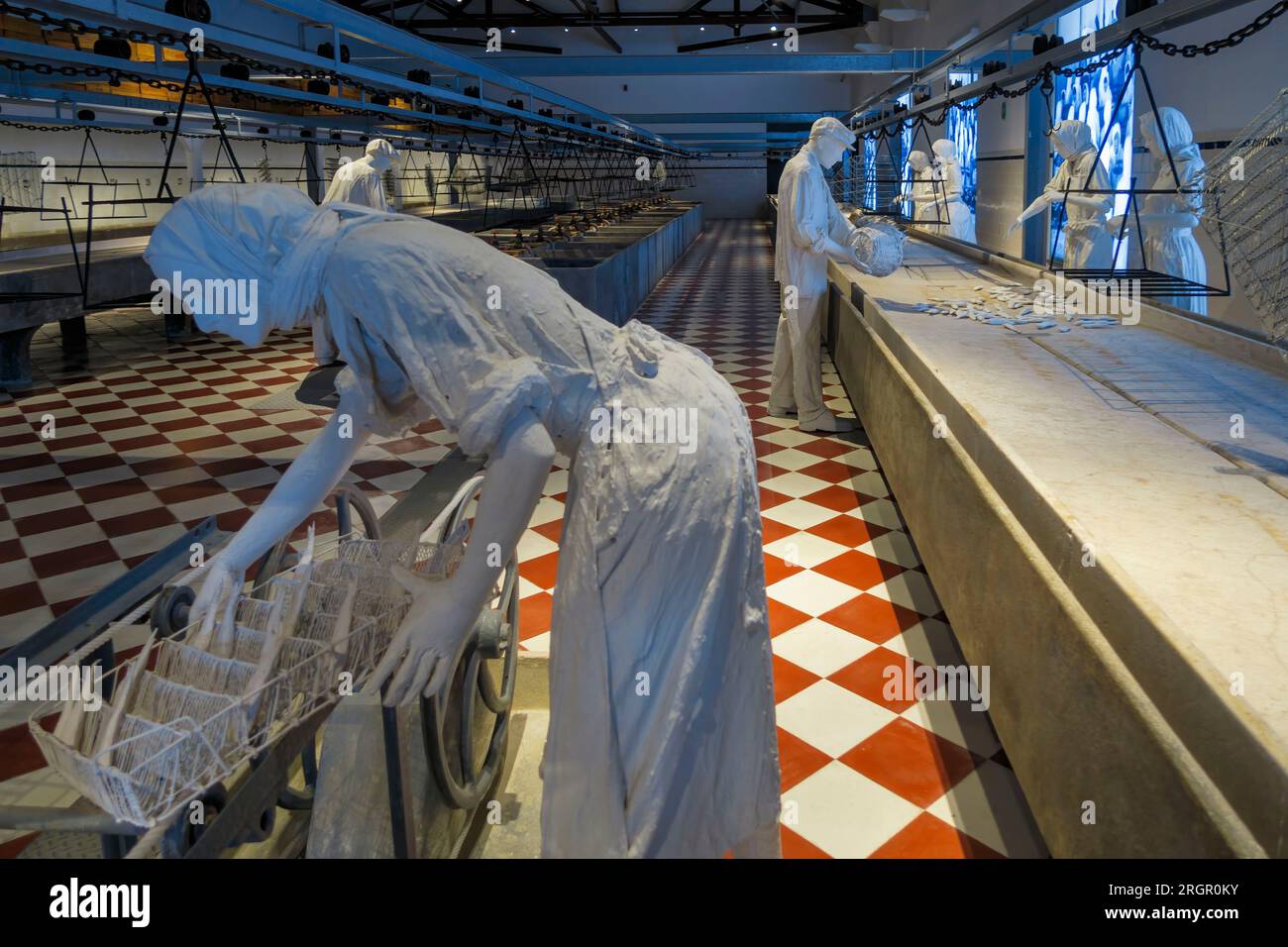 Statues depicting work at a fish canning factory at the Portimão Museum
