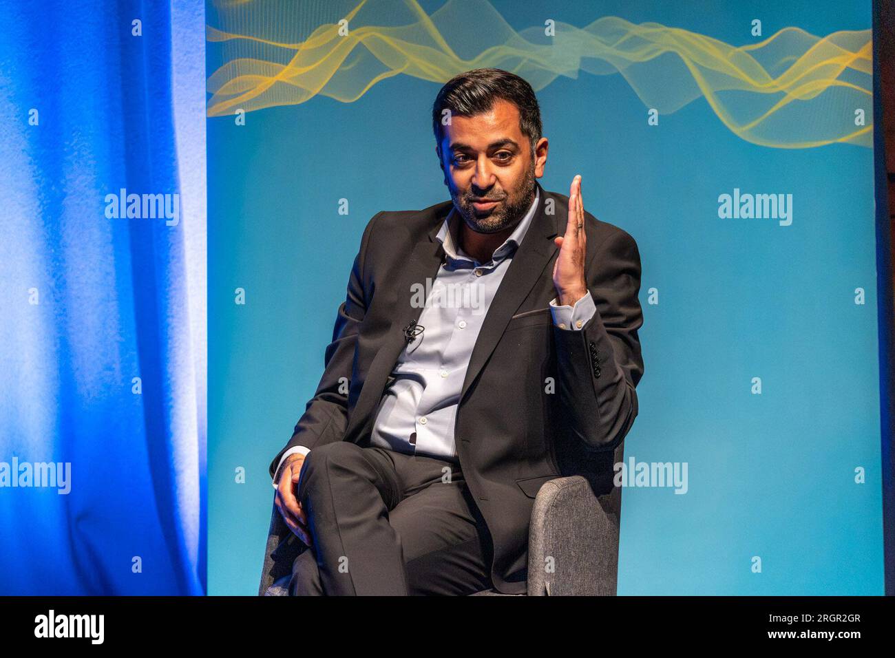 Edinburgh, United Kingdom. 11 August, 2023 Pictured: First Minister of Scotland and SNP leader Humza Yousaf MSP is interviewed by LBC presenter Iain Dale at the Edinburgh Fringe. When asked about Angus Brendan McNeill leaving the SNP, Yousaf said, 'We can’t pick and choose when to be a member of the SNP. It’s for the electorate to decide'. Credit: Rich Dyson/Alamy Live News Stock Photo