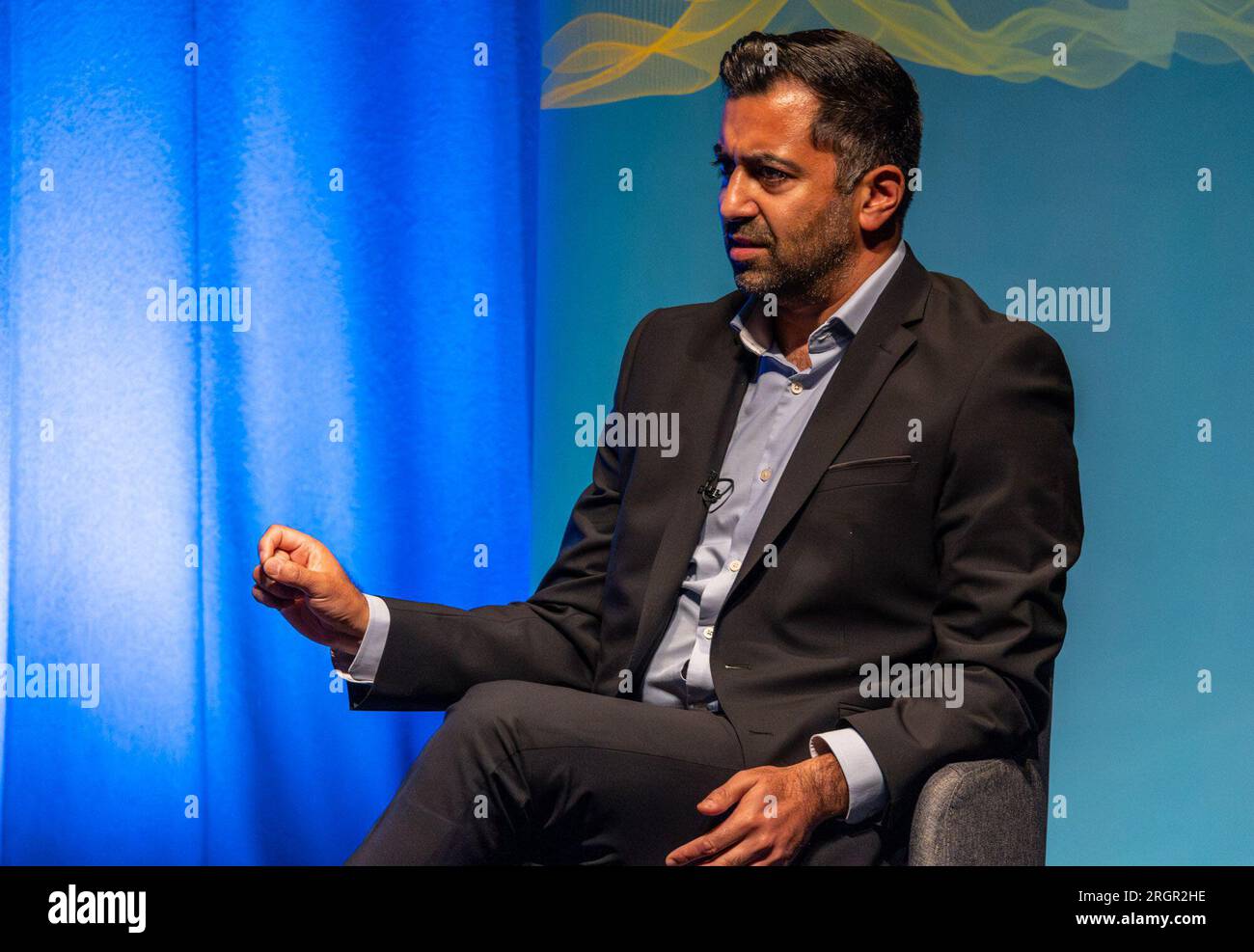 Edinburgh, United Kingdom. 11 August, 2023 Pictured: First Minister of Scotland and SNP leader Humza Yousaf MSP is interviewed by LBC presenter Iain Dale at the Edinburgh Fringe. When asked about Angus Brendan McNeill leaving the SNP, Yousaf said, 'We can’t pick and choose when to be a member of the SNP. It’s for the electorate to decide'. Credit: Rich Dyson/Alamy Live News Stock Photo