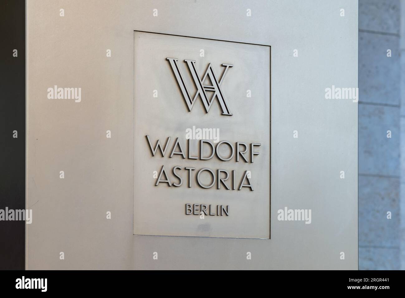 Waldorf Astoria logo sign next to the entrance of the luxury hotel. The
