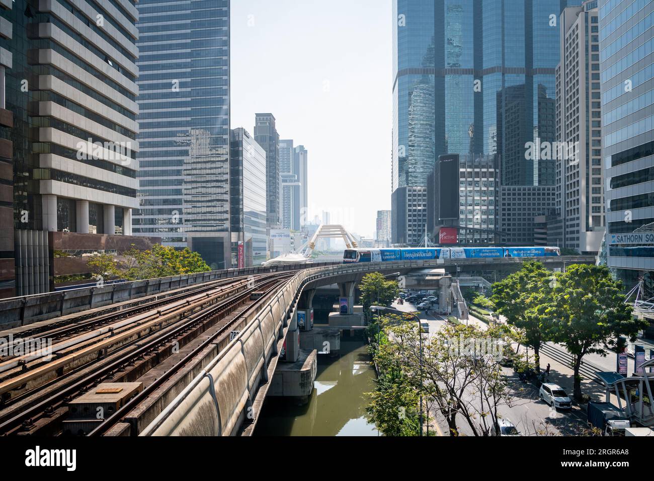 A train passes through Chong Nonsi BTS sky train station over Naradhiwas Rajanagarindra Rd