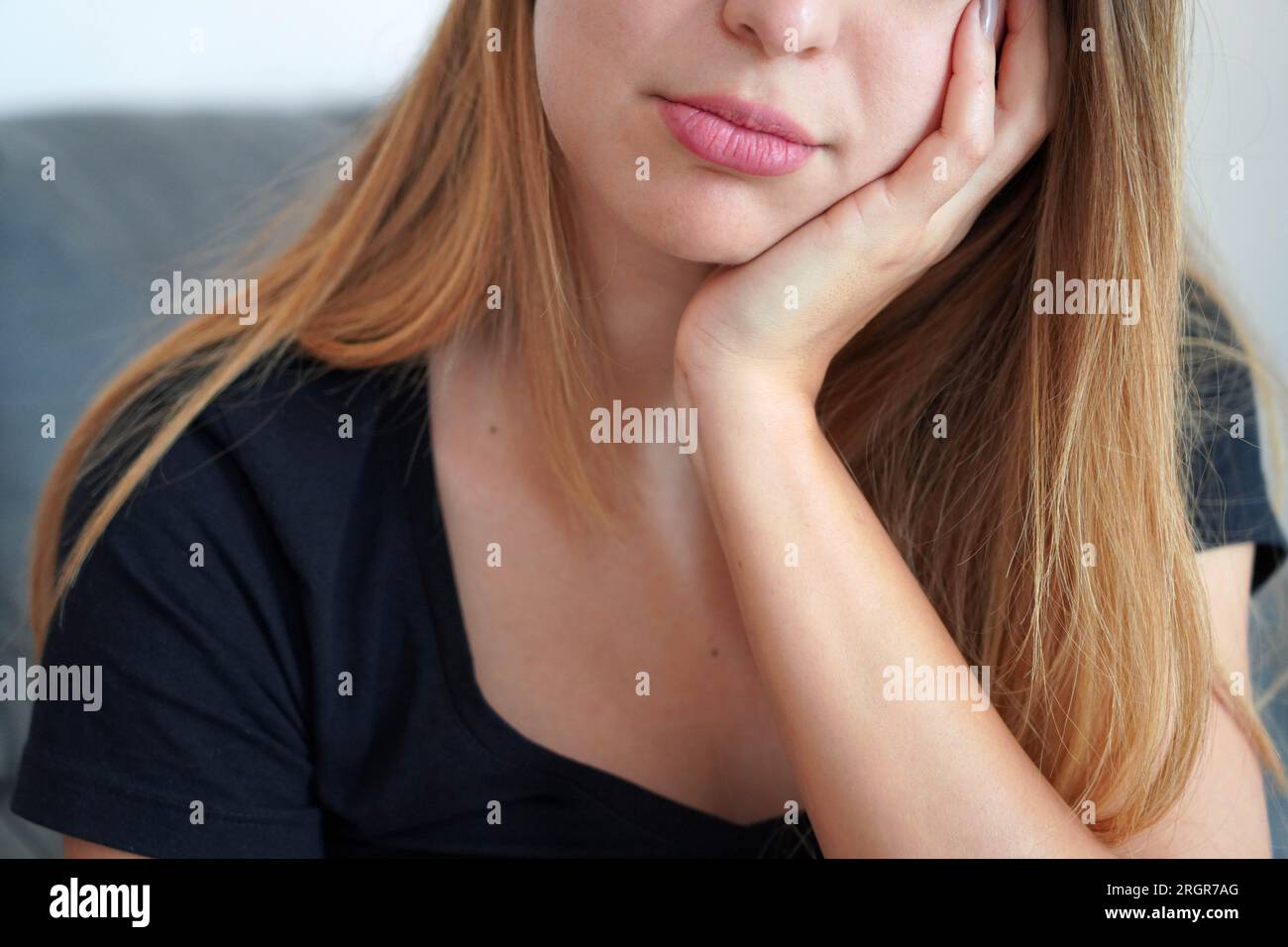 Loneliness in Youth. Bored girl alone in her room at home. Trouble at school. Stock Photo