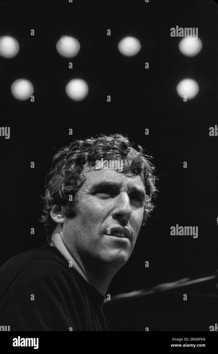 Popular musician and composer Burt Bacharach in recording studio - 1975. Photograph by Bernard Gotfryd. Burt Freeman Bacharach (12, 1928 – February 8, 2023) was an American composer, songwriter, record producer, and pianist who is widely regarded as one of the most important and influential figures of 20th-century popular music. Starting in the 1950s, he composed hundreds of pop songs, many in collaboration with lyricist Hal David. Bacharach's music is characterized by unusual chord progressions and time signature changes, influenced by his background in jazz. Stock Photo