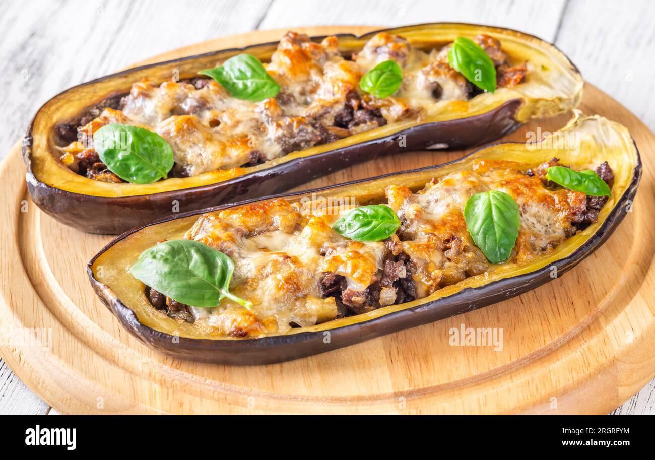 Sausage stuffed eggplant boats with melted cheese Stock Photo Alamy