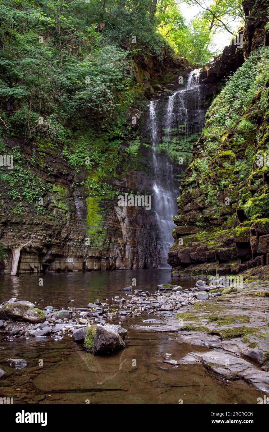 Sgwd Einion Gam, also known as The Fall of the Crooked Anvil, is one of the lesser known waterfalls in the Brecon Beacons, National Park, Wales Stock Photo