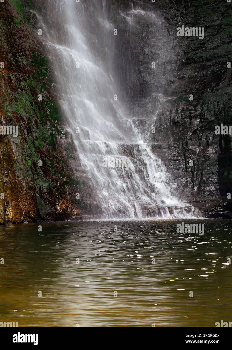 Sgwd Einion Gam, also known as The Fall of the Crooked Anvil, is one of the lesser known waterfalls in the Brecon Beacons, National Park, Wales Stock Photo