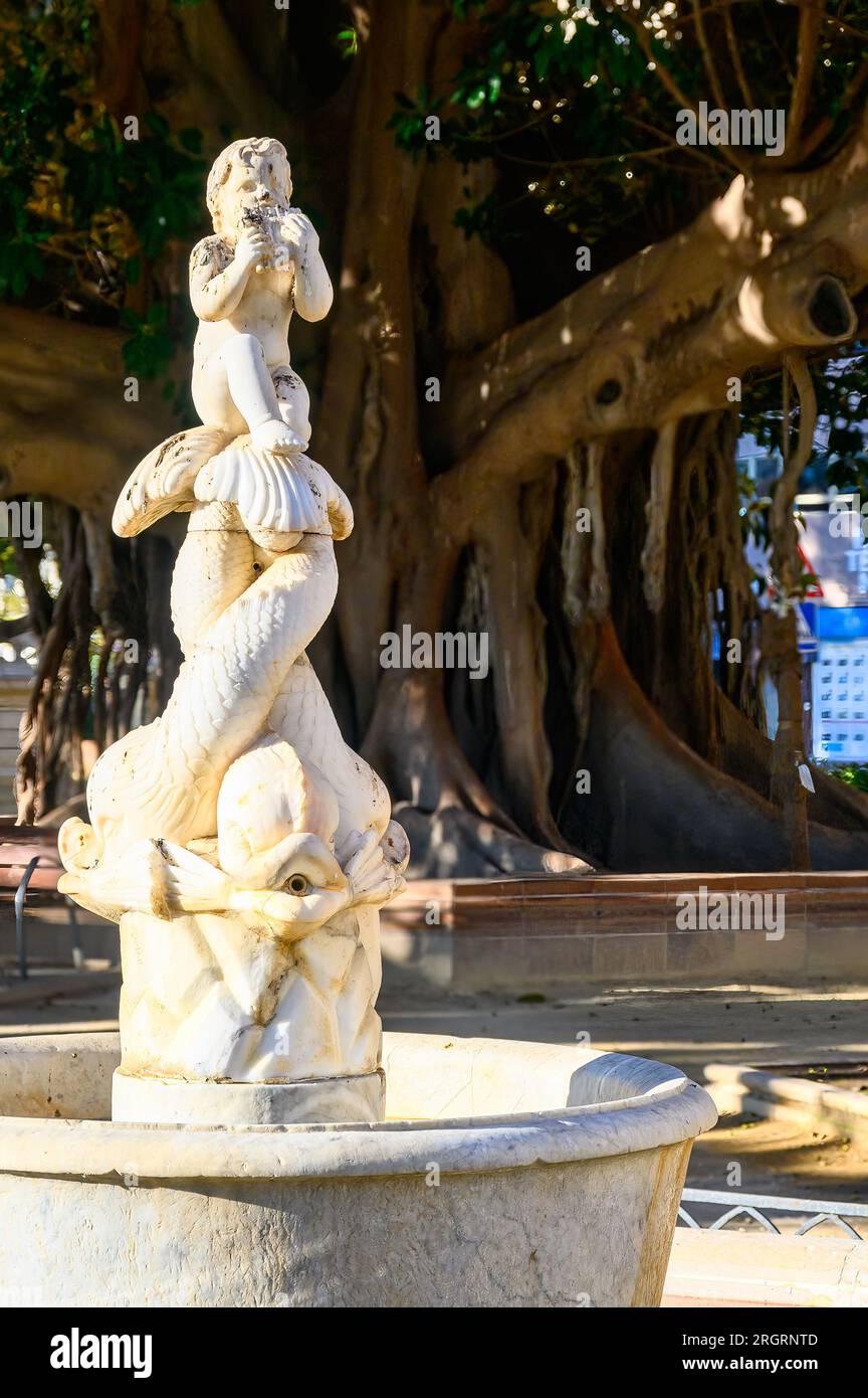 Alicante, Spain,  Ancient marble sculpture in a fountain located in the Canalejas Park in the waterfront district of the city. Stock Photo