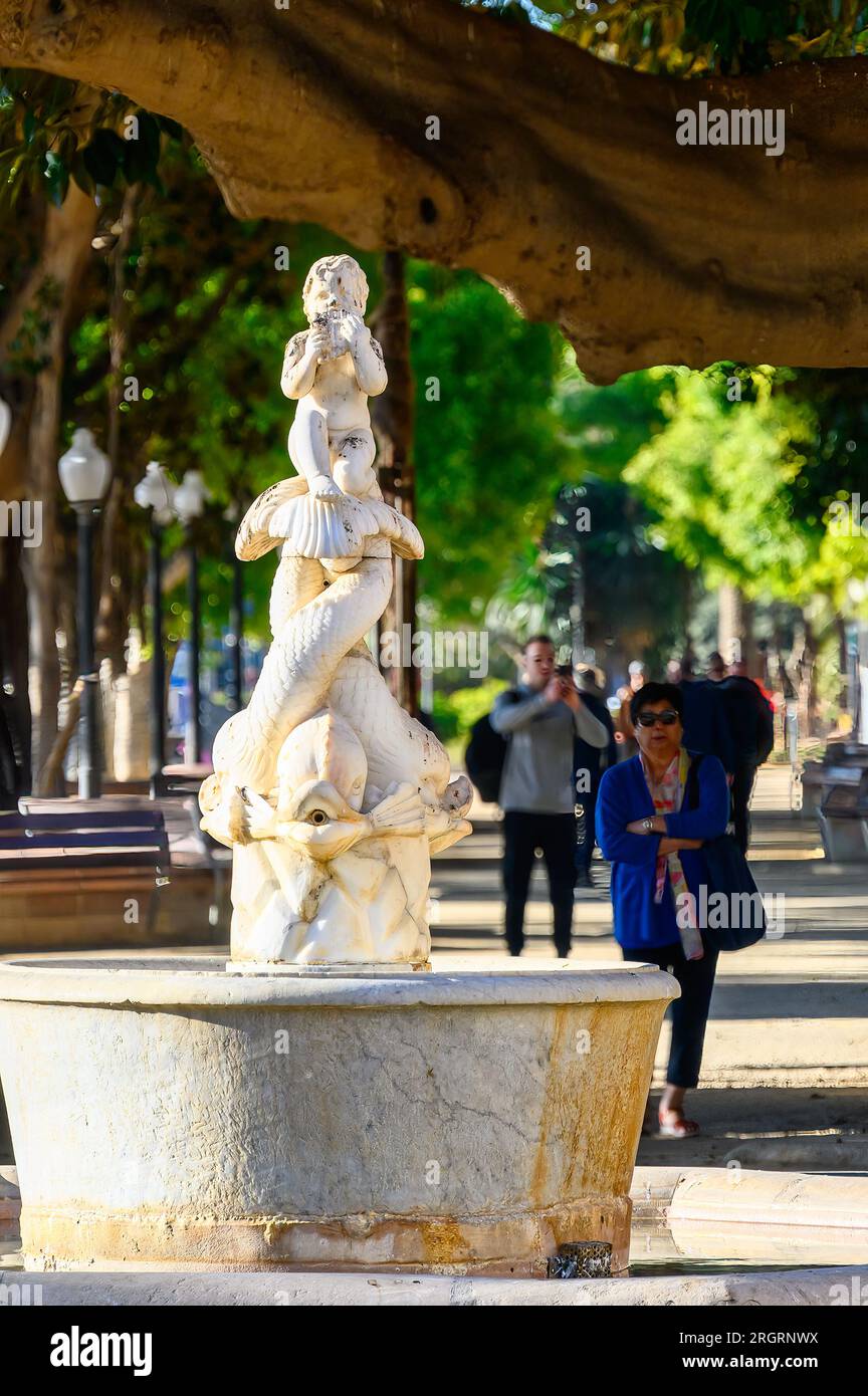 Alicante, Spain,  Ancient marble sculpture in a fountain located in the Canalejas Park in the waterfront district of the city. Stock Photo