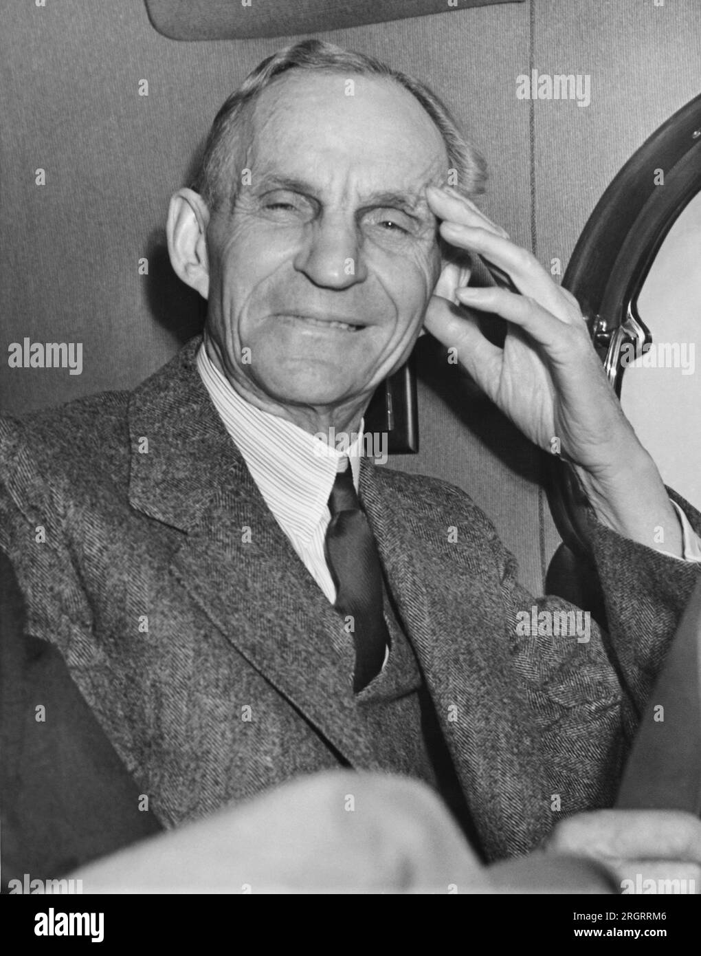 Washington, D.C.  April 27, 1938 A smiling Henry Ford as he rode away from the White House after having had lunch with President Roosevelt. Stock Photo