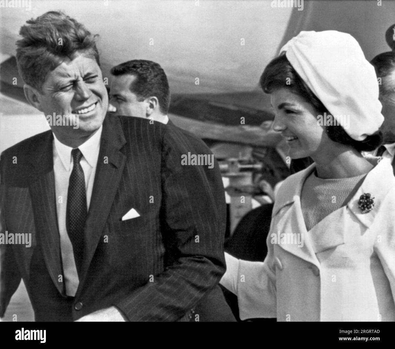Andrews Air Force Base, Washington D.C.: 1962. President and Mrs. Kennedy walk from their jet plane to a waiting helicopter upon their return to Washington from a visit to Mexico City. Stock Photo
