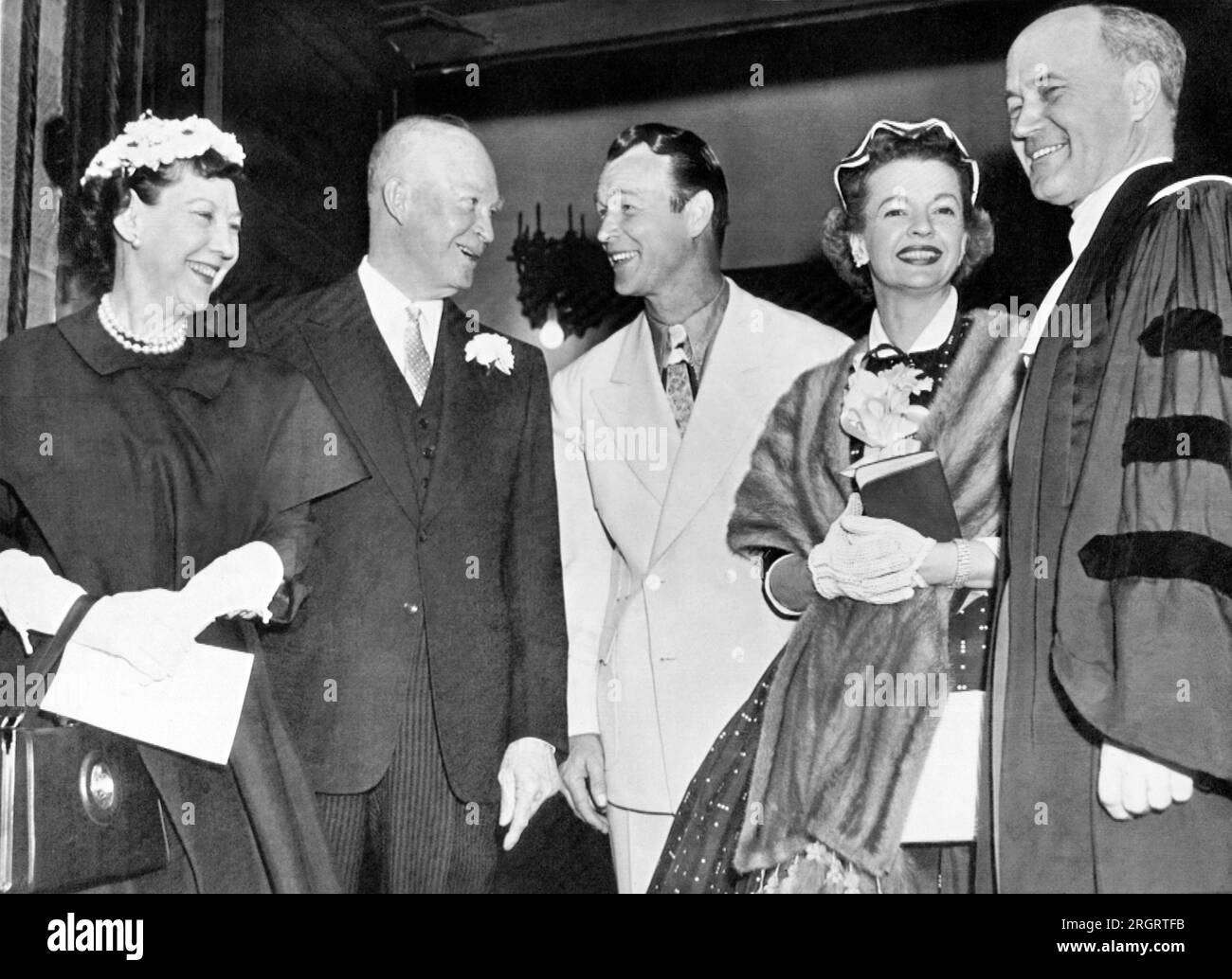 Washington, D.C.:  April 1, 1956 President and Mrs. Eisenhower talk with cowboy movie star Roy Rogers and his wife, Dale Evans, at the National Presbyterian Church here where they both attended Easter services. Stock Photo