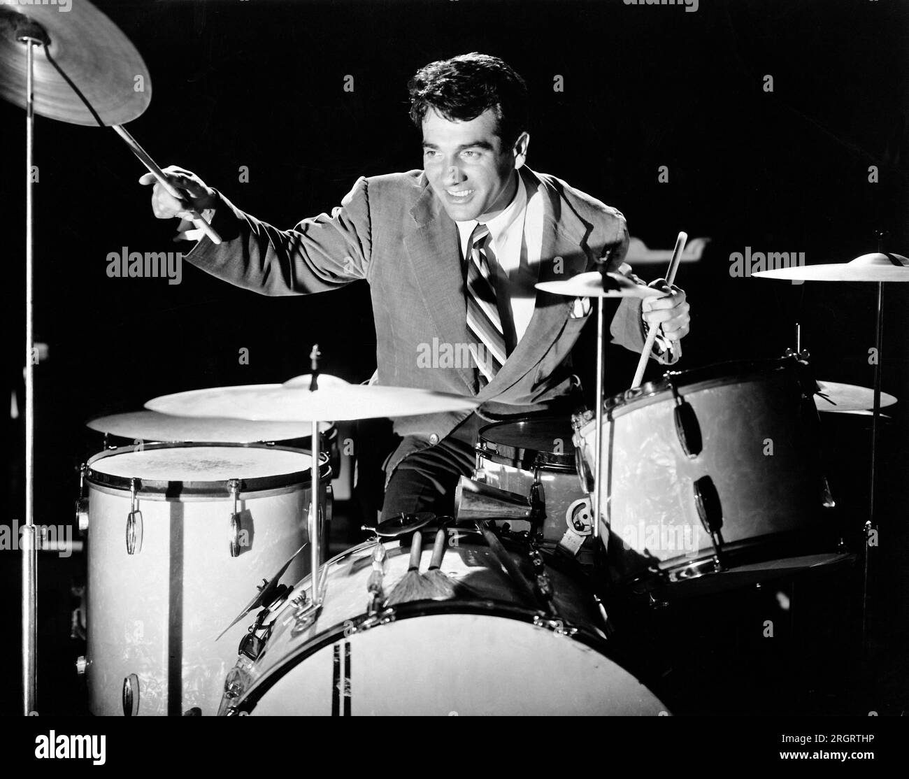 United States:  c. 1947 Jazz drummer and compser Gene Krupa playing the drums. Stock Photo