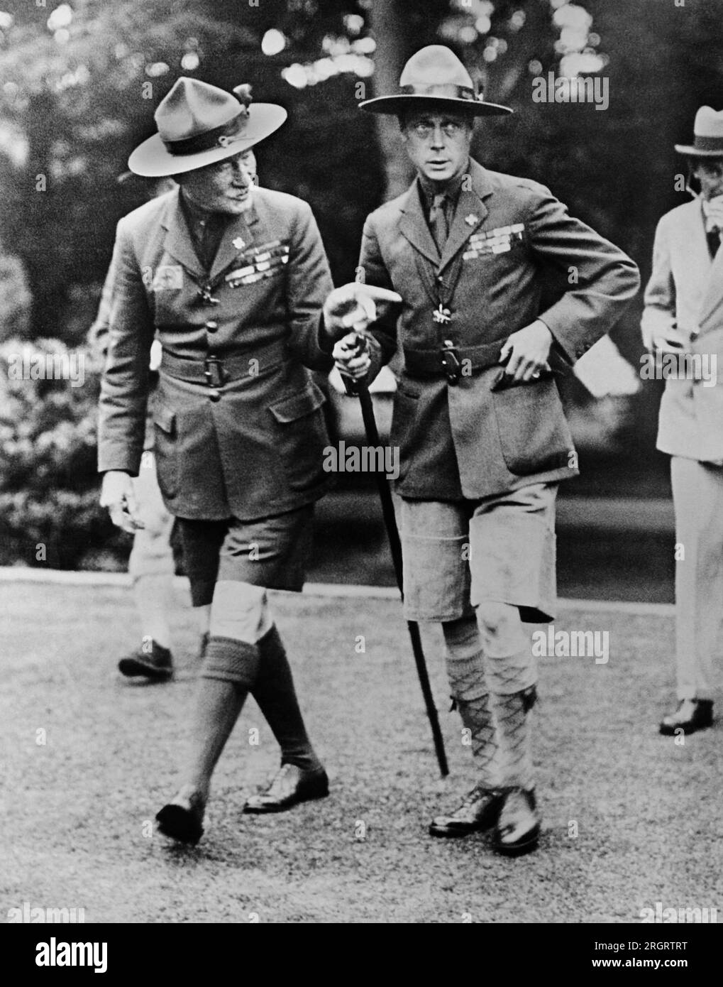 Birkenhead, England:  c. 1926 Sir Robert Baden-Powell, Chief Scout and founder of the Boy Scouts, (left) and the Prince of Wales, who is the Chief Scout in Wales, shown during the Prince's visit to the World Jamboree Camp at Arrowe Park. Stock Photo