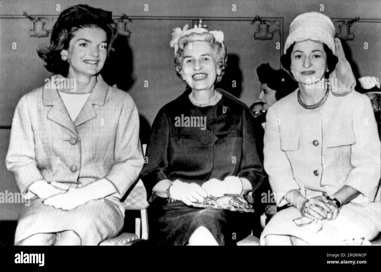 Washington, D.C.   May, 1962. Mrs. Jacqueline Kennedy, Mrs. Wallace Bennett of Utah, and Lady Bird johnson at a congressional wives luncheon. Stock Photo