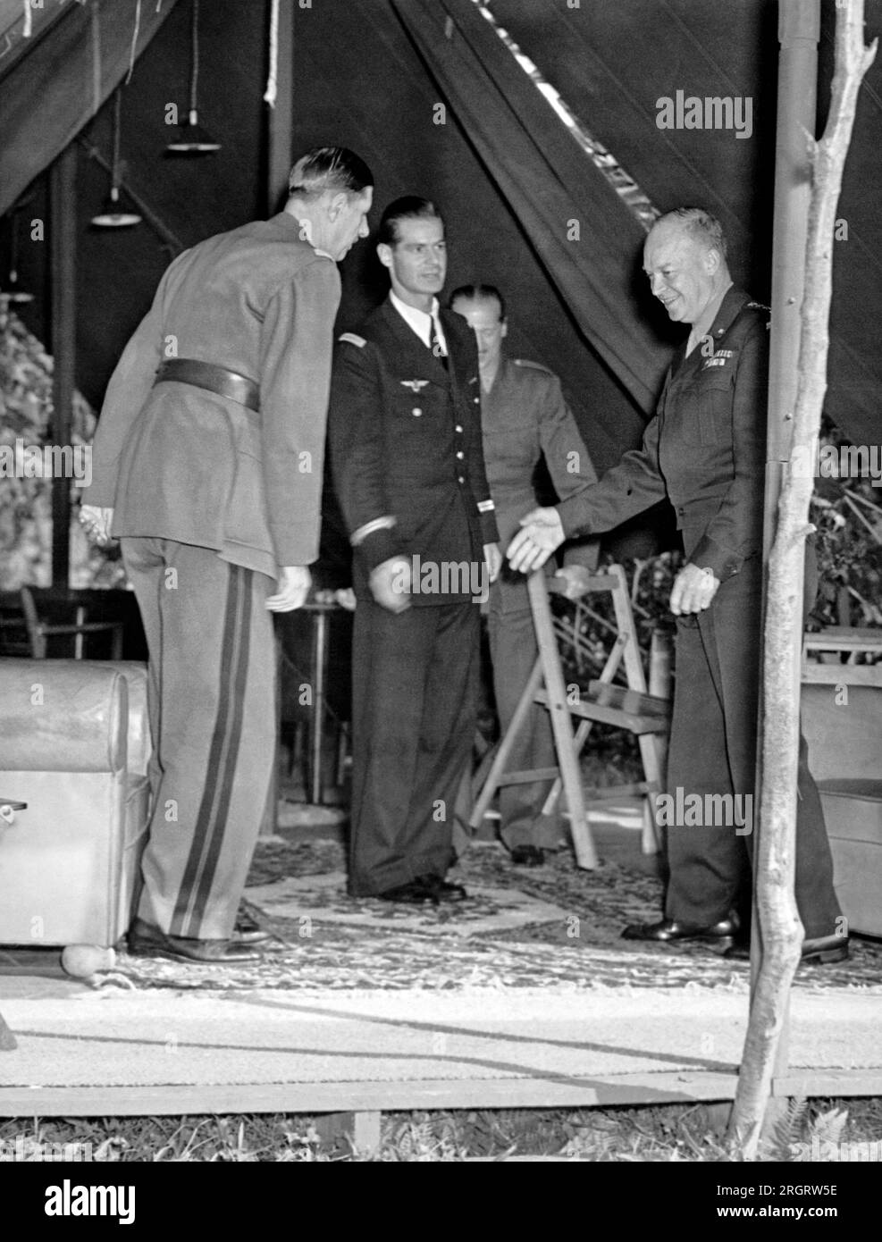 France:  August 22, 1944 General Dwight Eisenhower greets French General Charles De Gaulle and his party as they arrive at his headquarters in France for a conference. Stock Photo