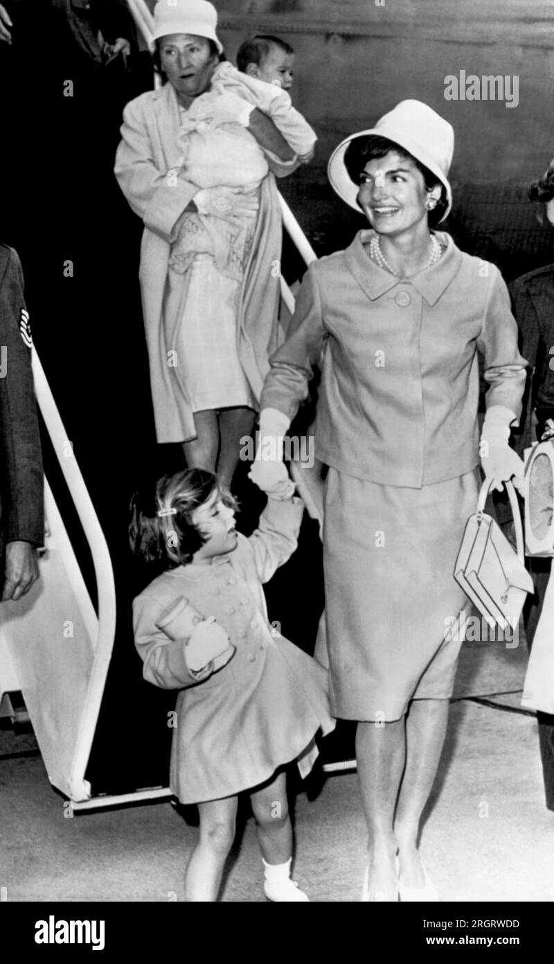Otis Air Force Base, Massachusetts:  June 30, 1961 Jacqueline Kennedy, with daughter Caroline in hand and son John Jr. carried by their nurse, arrives to spend the long July Fourth weekend at Hyannis Port with the President. Stock Photo