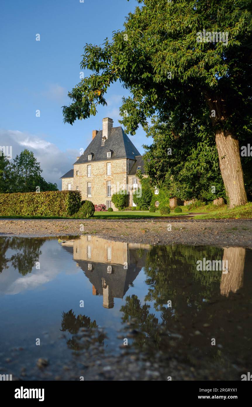 French chateau with reflection in puddle Stock Photo