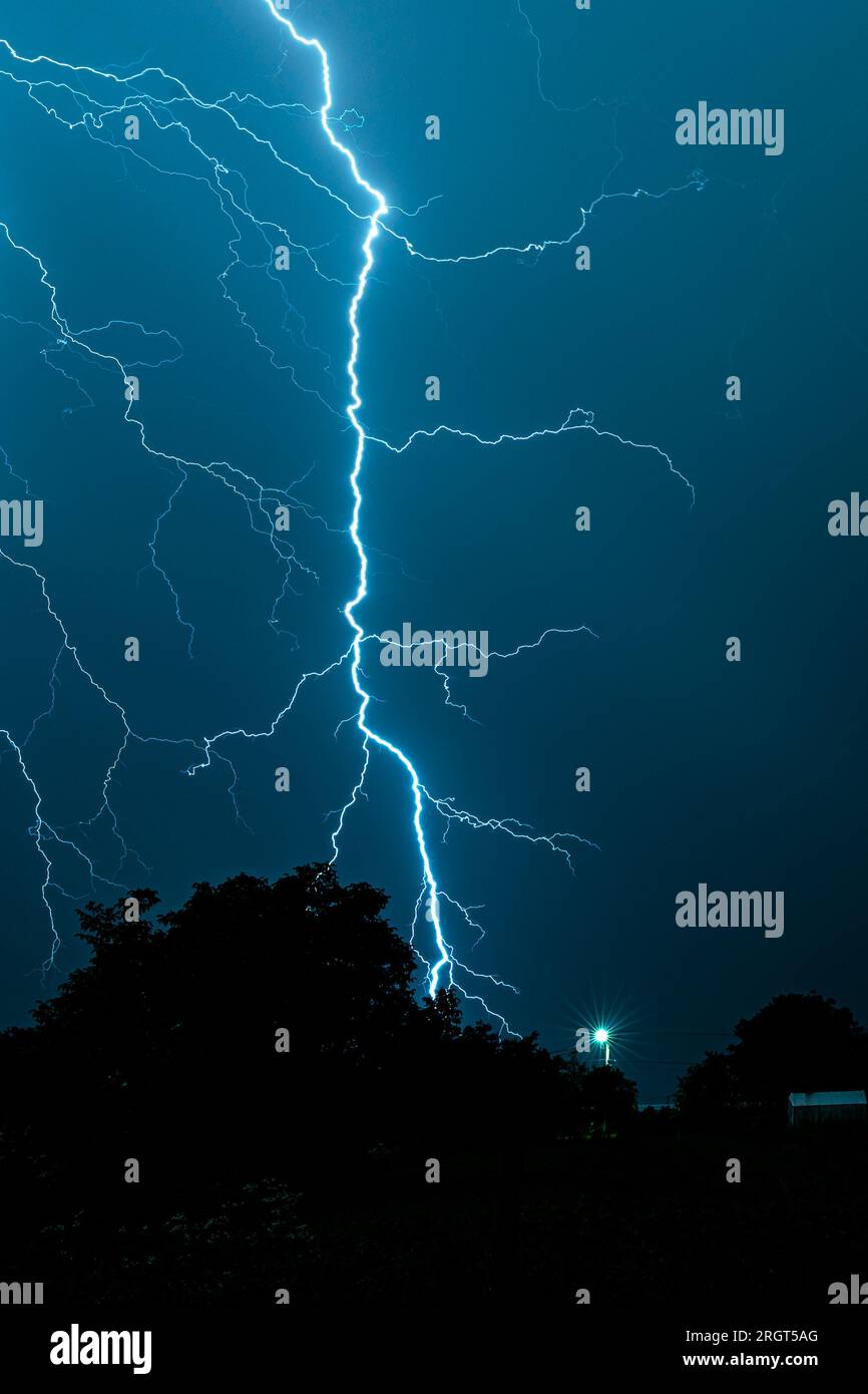 Thunderbolt of lightning strikes earth Stock Photo Alamy