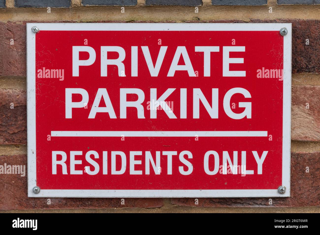 Private Parking Residents Only sign, red and white sign outside a property house home, England, UK Stock Photo
