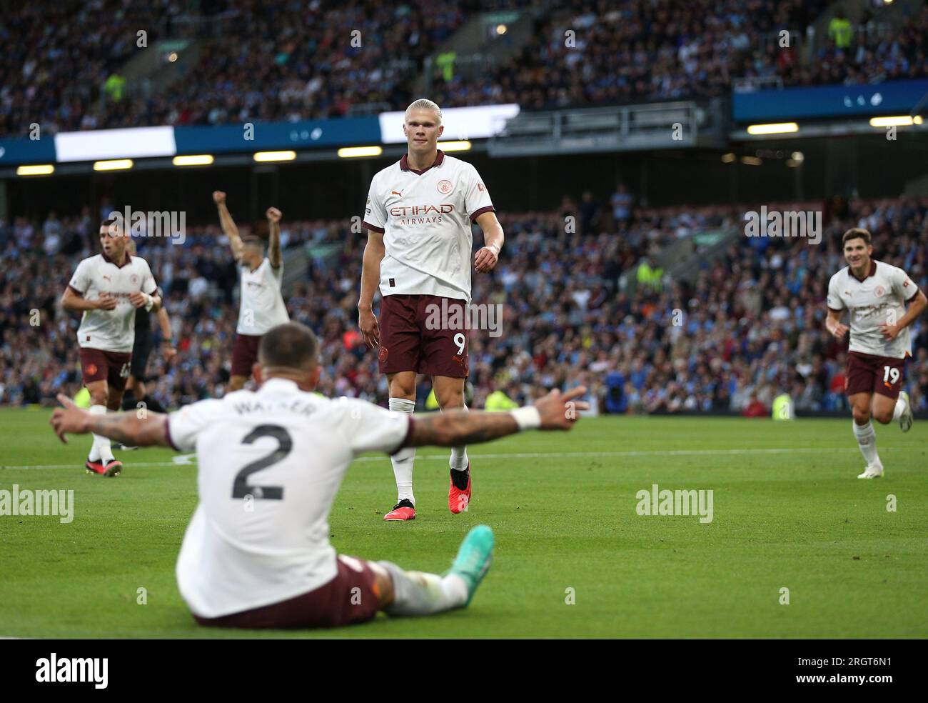 Manchester City's Erling Haaland celebrates scoring their side's second goal of the game with team-mate Kyle Walker during the Premier League match at Turf Moor, Burnley. Picture date: Friday August 11, 2023. Stock Photo