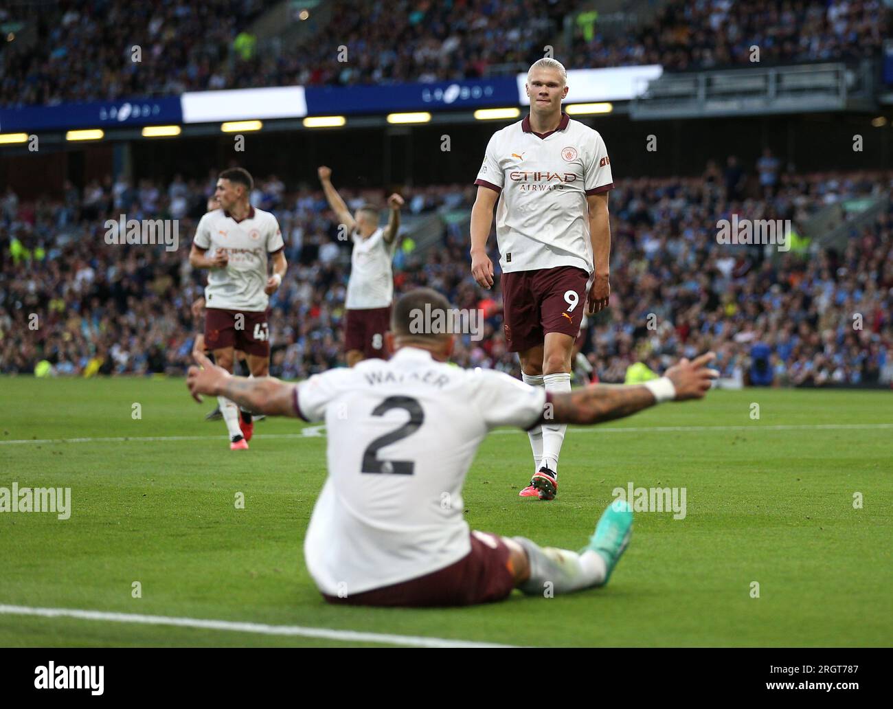 Manchester City's Erling Haaland celebrates scoring their side's second goal of the game with team-mate Kyle Walker during the Premier League match at Turf Moor, Burnley. Picture date: Friday August 11, 2023. Stock Photo